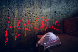 Icon image, menekel on concrete wall, lettering pandemic, handwriting with red laser beam, respirator Icon image, menekel on concrete wall, lettering pandemic, handwriting with red laser beam, respirator